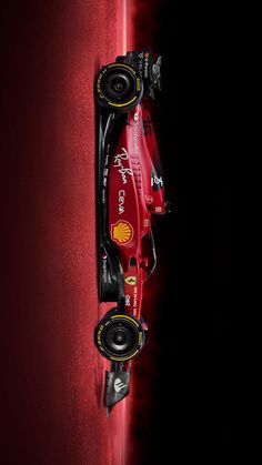 the new ferrari formula car is shown in this artistic photograph, taken from above on a dark background