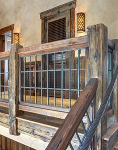 an old building with wooden railings and windows