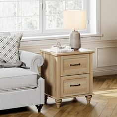 a living room scene with focus on the end table and chair next to the couch