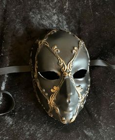 All models are manufactured in Italy and distributed in the United States. Our masks are made according to the oldest Venetian techniques and with the most innovative materials in the sector. Each mask is a unique work of craftsmanship delivered directly to your home, created and personalized just for you. With this mask you will impress everyone at any dance or costume party. 🎭 🎃 The mask is unisex and one size fits all.  👨🏼 It is made with hypoallergenic and certified materials. ✅ Only mad Black Medieval Masquerade Mask For Fantasy Events, Medieval Black Masquerade Mask For Fantasy Events, Black Medieval Masquerade Mask, Medieval Black Masquerade Mask, Medieval Black Mask For Masquerade, Medieval Black Mask For Costume, Medieval Black Costume Mask, Traditional Black Costume Masks And Prosthetics, Traditional Black Masks And Prosthetics For Carnival