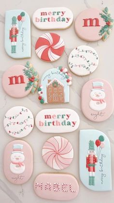 decorated cookies are arranged on a table