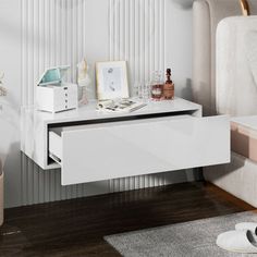 a white table with drawers on it in a room