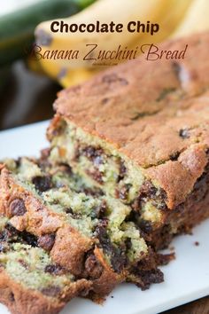 a loaf of chocolate chip banana bread on a white plate