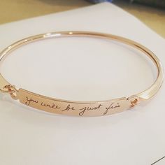 Actual Handwriting bangle, Custom handwritten bar bracelet, Personal engraved signature cuff, Memorial Keepsake Gift, Rose gold name bangle. This cuff bangle is 152 mm in circumference , and 2.7 mm thick. The engraving plate measures 35x6 mm. or 6 inches in diameter and .10 inches thick. The engraving plate measures 1.45x0.23 inches. The perfect way to remember someone close to you. Bangle is available in 3 options: ROSE GOLD, SILVER, 16K GOLD PLATED. The bracelet is gift wrapped and ready for g Engraved Bracelet For Her, Engraved Bar Bracelet, Engraved Bangle, Handwriting Bracelet, Engraved Cuff, Signature Bracelet, Engraved Handwriting, Personalised Bangle, Rose Gold Bangle