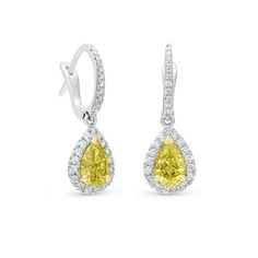 A pair of expertly matched fancy colour pear-shaped diamonds form the centrepiece of this pair of earrings. Each hero diamond is prong-set in 18K yellow gold to accentuate the characterful hue, and delicately encircled by a row of round brilliant micropavé diamonds, set in 18K white gold, and suspended from micropavé hoops. These earrings are a timeless classic, and would wear beautifully with both a ring and a necklace from De Beers’ Aura collection. Every diamond within them has been ethica De Beers Jewelry, Yellow Diamond Earring, Diamond Stacks, Diamond Earring, Jewelry Images, Couture Jewelry, Pear Shaped Diamond, Fine Jewelry Collection, Bridal Jewelry Sets