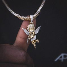 When your guardian angel needs a little extra. The "Masked Angel" pendant depicts an angel wielding a Draco. Flooded in dozens of hand-set stones, lining the wings, bandanna and bail, this unique piece is ready to protect at all costs. Worn stacked or solo, it's the perfect drip. This product is guaranteed for life - GLD will repair the item should you experience any defects in craftsmanship or breakage. Specifications - 1" x 1 3/4" (Width x Height) - Weight: (Weight can vary +/- 5 grams) Gold P Your Guardian Angel, Angel Pendant, Skull Pendant, Vermeil Jewelry, The Wings, Custom Earrings, Skull Ring, Guardian Angel, An Angel