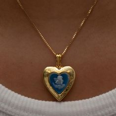 The Blue Angel Photo Locket Necklace This item is handmade to order. Please click the ‘SHIPPING’ bubble for more information on turnaround times. The locket is fully functional, with an option to include a photo! Metal: 18KT Gold Vermeil Chain type: Box Length: 16" total Locket Size: 0.75" NOTE: Please do not get your lockets wet or submerge them in water. As these items include paper goods, we will not be liable for any water damage that can ruin your photo. *Any items purchased with a discount Vintage Dainty Jewelry, Blue And Gold Aesthetic, Vintage Gold Necklace, Photo Locket Necklace, Blue Angel, Heart Locket Necklace, Dope Jewelry, Photo Locket, Funky Jewelry