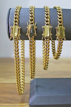 14k Gold Filled Miami Cuban Link Chain Bracelets 6mm Thickness Featuring Double Safety Lock Box Clasp, Curb Link Chain Wholesale and Jewelry Supplies. A perfect gold chain made from 14k gold filled, the 6mm Miami Cuban chain style provides a large, fashionable look. Each piece comes with a double safety lock box clasp. Choose your size and feel the vibe. Available Sizes: - Bracelets: 7 inches, 8 inches, 9 inches - Closure: Box | Chain style: Curb MULTIPLE CHOICES: Our Cuban Link Collection is av Miami Cuban Link Chain, Miami Cuban Link, Cuban Link Chain Necklaces, Miami Cuban, Chain Bracelets, Box Clasp, Cuban Link Chain, Cuban Chain, Cuban Link