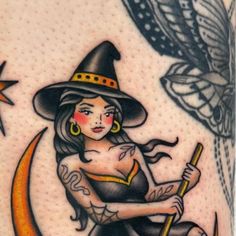 a woman sitting on the moon wearing a witches hat and holding a broom in her hand