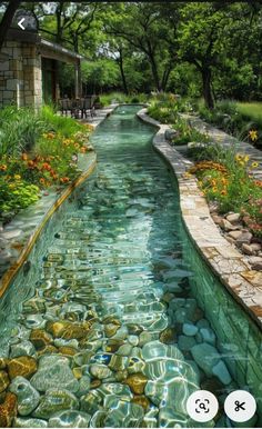 an image of a river flowing through a garden