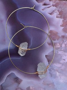 These gorgeous Clear Quartz wire wrapped healing crystal hoop earrings are a minimalist style perfect in your healing, meditative or sacred space to create a soothing, serene, and spiritual vibe. ॐ These beauties are lightweight and feature a removable silicone earring back for secure wear! This breathtaking bohemian style is available in 3 different sizes , 1" , 1 1/2" or 2" inches in diameter. Also available in stainless silver steel or brass gold. These raw natural earrings make a great gift Minimalist Adjustable Crystal Earrings, Minimalist Wire Wrapped Crystal Earrings As Gift, Minimalist Wire Wrapped 14k Gold Filled Hoop Earrings, Minimalist Wire Wrapped Crystal Dangle Earrings, Minimalist Adjustable Wire Wrapped Wrap Earrings, Minimalist Wire Wrapped Hoop Earrings As Gift, Minimalist 14k Gold Filled Wire Wrapped Hoop Earrings, Spiritual Hoop Earrings With Ear Wire, Minimalist Wire Wrapped Round Hoop Earrings