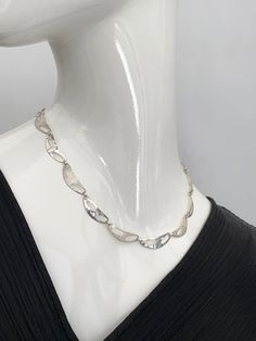 "Here is a stylish vintage silver modernist necklace. The reverse has the maker's initials of 'ELd' and 925 silver, there are further stamped marks next to the maker's initials but they are too small to read even with a x10 magnification jeweller's eyeglass so this piece is hard to date exactly.  When fastened, open and laid flat, the length of the necklace is 17.75\" inches. The condition is excellent overall, please see all the photos and zoom in for details. The weight is 10.11 gms." Modern Silver Necklace For Formal Occasions, Modernist Polished Silver Necklaces, Modern Metal Necklaces With Engraving, Modern Necklace With Sterling Silver Clasp, Silver Modernist Necklaces For Formal Occasions, Modern Engraved Metal Necklaces, Silver Modernist Necklace For Formal Occasions, Modernist Silver Necklace For Formal Occasions, Modern Silver Necklace For Anniversary