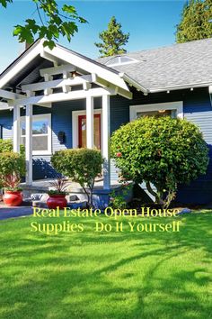 a blue house with white trim and red planters in the front yard on a sunny day