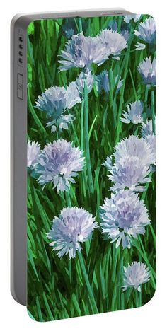 a painting of purple and white flowers in the green grass by an artist's easel