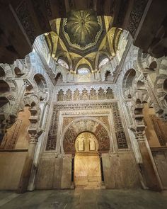 the inside of an ornate building with intricate carvings