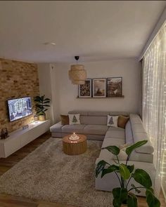 a living room filled with furniture and a flat screen tv