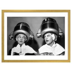 two women with helmets on their heads