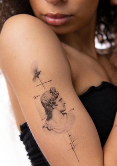 a woman with a tattoo on her arm