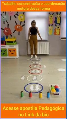 a woman standing on top of a white floor next to lots of colorful circles and toys