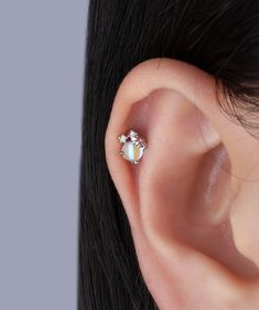 Upgrade your jewelry game with our opal flower studs! These sweet and cute earrings will add a touch of elegance and charm to any outfit. Perfect for everyday wear. Detail： -Post material: gold plated with internal stainless steel or stainless steel. Cubic Zirconia -Gauge: 16g | 1.2mm-Post length: 6mm-Dimensions: 5.6mm Length x 5.7mm Width-Include: single item -Closure: screw ball back * Shop extra ball backing here. * Piercings are sold individually for layering purposes. Sold individually. Mix Dainty White Piercings As Gift, Flower Stud, Flower Studs, Small Flowers, Cute Earrings, Piercings, Screw, Cubic Zirconia, Layering