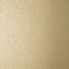 a close up view of a metallic surface with some light colored paint on it's edges