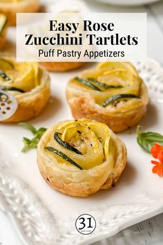 easy rose zucchini tartles puff pastry appetizers on a white plate