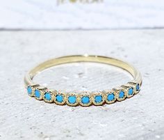 Don't miss this opportunity to own this beautiful gemstone ring crafted in 14k gold filled. You can wear the rings as a set together or each ring by it self. => Gemstone Type - Turquoise Arizona => Gemstone Size -1.5mm => Total Number of Gemstones - 11 => Metal Type - 14k Gold Filled (Tarnish Resistant And Nickel Free) - also available in 925 sterling silver ~ Please contact me for pricing on a sizes  larger than 11 * ~Feel free to ask me about custom made designs. ❏ Replacements and custom orde Adjustable Gold Turquoise Ring In Fine Jewelry Style, Gold Turquoise Ring With Accent Stones As A Gift, Gold Turquoise Ring With Accent Stones For Anniversary, Gold Stackable Turquoise Ring For Anniversary, Elegant 14k Gold Turquoise Birthstone Ring, Gold Turquoise Ring With Accent Stones For Gift, Gold Stackable Turquoise Promise Ring, Stackable Gold Turquoise Ring In 14k Gold, Adjustable Gold Turquoise Ring Fine Jewelry