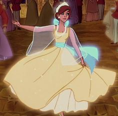 the princess and the frog are dancing in front of other people at an event together