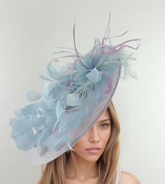 Lilac Baby Blue Derby Fascinator Hat Headband Kentucky Ascot Wedding Tea Party Statement Floral Rose Woman Headwear Powder Blue Lavender Payton - Lilac & Baby Blue Kentucky Ascot Derby Fascinator Hat The Payton saucer disc feather fascinator comprises a beautiful mass of lilac and baby blue feathers on a large sinamay disc base.  Base measures 14 inches wide This lilac and baby blue wedding fascinator is mounted with a matching headband. If you prefer a headband to match your hair, please make a note at check out what colour headband you want. We make each fascinator hat just to order just for you, we would prefer if you did not order for choice. If colour match is important to you please ask for free fabric swatch to be sent to you - this reduces returns and disappointment.   We can also Blue Mini Hat For Spring Wedding, Fitted Blue Hat For Garden Party, Light Blue Headpiece For Kentucky Derby Party, Fitted Blue Fascinator For Garden Party, Blue Fitted Fascinator For Garden Party, Blue Fascinator For Garden Party, Light Blue Headpiece For Royal Ascot Party, Light Blue Mini Hat For Kentucky Derby Party, Whimsical Blue Fascinator For Party