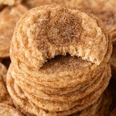 a pile of cookies with sugar on top