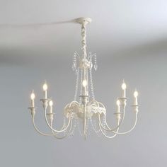 a white chandelier hanging from the ceiling