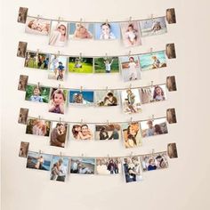 multiple photos hanging from clothes pins to display them on a line with clips and magnets