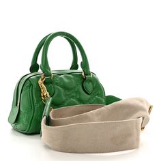 This is an authentic GUCCI Calfskin GG Matelasse Mini Bowler Bag in Spring Green and Natural. This shoulder bag is crafted of green smooth and supple calfskin leather with matching green leather trim. This bag features leather rolled leather top handles, a beige canvas adjustable shoulder strap, a chain strap, and gold hardware. The wrap around zipper opens to a fabric interior with a leather patch pocket. Bowler Bag, Gucci Crossbody Bag, Gucci Crossbody, Small Messenger Bag, Leather Roll, Vintage Monogram, Gucci Shoulder Bag, Bag Light, Wallet Chain