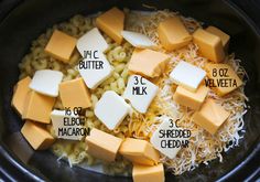 the ingredients for macaroni and cheese in a crock pot are shown here