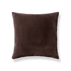 a brown pillow on a white background