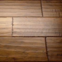 a close up view of a wooden floor with some wood grains on the surface