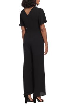 A belted waist cinches this wide-leg jumpsuit designed in flirty flutter-sleeved silhouette. 59 1/2" full length (size 4) Crew neck Short sleeves Back zip closure Lined 97% polyester, 3% spandex Machine wash, dry flat Imported Model Stats: 5'10" height; 34" bust; 27" waist; 35" hips. Model is wearing size 4. Wide Leg Workwear Jumpsuits With Tie Waist, Elegant Belted Solid Jumpsuits And Rompers, Elegant Wide Leg Belted Jumpsuits And Rompers, Belted Wide-leg Jumpsuit For Work, Belted Wide Leg Jumpsuits For Work, Wide-leg Belted Jumpsuit For Work, Formal Full Length Jumpsuits And Rompers, Wide Leg Belted Jumpsuits For Workwear, Black Floor-length Jumpsuit For Formal Occasions