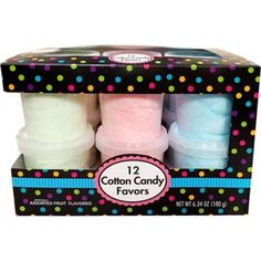 four blue cotton candy favors in a black cardboard box with colorful polka dots on it