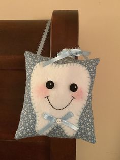 a pillow with a smiling face on it