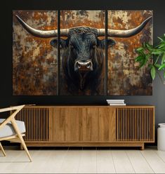 a painting of a bull's head on a wall in front of a wooden cabinet