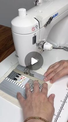 a woman is using a sewing machine to sew