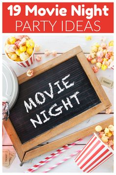 a movie night party with popcorn and movies on the table