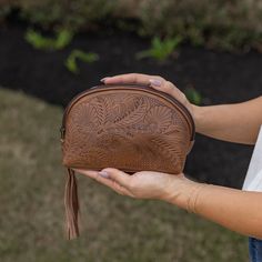 "What makes this so special is that it is a high quality imported leather that has a beautiful, natural sheen, and SOFT leather feel whose durability will last years to come. Many leathers from other countries are hard and stiff. This Paraguayan leather has been perfectly tanned to be soft and supple and will become even softer the older it becomes.  These leather bags and purses are uniquely created ONE AT A TIME by expert leather artisans in Itaugua, Paraguay. Roomy triangle shaped design fits Soft Leather Coin Purse For Daily Use, Hand Tooled Travel Clutch, Leather Clutch For Gift, Daily Use Soft Leather Coin Purse, Artisan Style Bag With Removable Pouch, Everyday Hand-tooled Leather Pouch, Brown Hand Tooled Pouch, Hand Tooled Pouch Bag For Daily Use, Hand Tooled Coin Purse