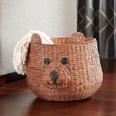 a woven basket with a bear face on it