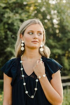 The bracelet that makes any outfit look better! Shimmery Mother of Pearl in iridescent ivory is the perfect go with anything stone. While a delicate beaded gold edging adds a touch of detail. This bracelet is totally adjustable. A statement worn alone or also perfect for the season's coolest layered looks! 18K gold plated over brass Size: adjustable length to fit all wrist sizes natural Mother of Pearl stones classic chic style perfect for layering Chic Adjustable Cream Jewelry, Chic Adjustable Pearl White Jewelry, Classic Chic Style, Outfit Look, Classic Chic, Statement Bracelet, Girl Gang, Layered Look, Designer Wear