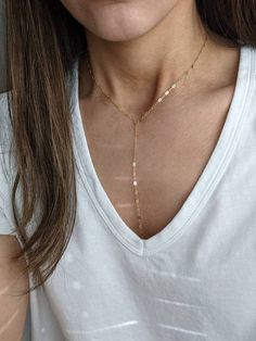 Dress up or casual for any occasion. This necklace is a classic transitional style.-14k gold filled chain & findings- 16" + 1" extension - 6" Y drop- 6mm spring ring closure- very lightweight, which is a plus for me Adjustable Minimalist 14k Gold-filled Chain Necklace, Minimalist Adjustable 14k Gold Filled Chain Necklace, Adjustable Minimalist 14k Gold Filled Chain Necklace, Adjustable Dainty Drop Necklace For Everyday, Adjustable 14k Gold-filled Chain Necklace, Dainty Adjustable Drop Necklace, Everyday Delicate Chain Drop Necklace, Adjustable Dainty Gold Lariat Necklace, Everyday Drop Necklace With Adjustable Dangle Chain