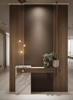 an elegant bathroom with marble counter tops and wooden paneling, along with potted plants