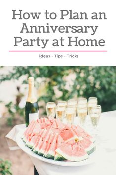 watermelon slices and champagne on a table with the words how to plan an anniversary party at home