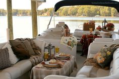 there are many couches and tables on the boat