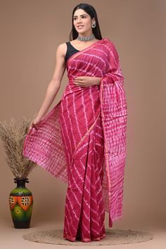 This is a beautiful pure chanderi silk saree with handblock printed design  Fabric - Chanderi silk  Technique - Hand block printed. Saree length - 5.5 mtr. Blouse - 1 mtr. Running . Easy wash and care . Please note - color may be vary a little due to sunlight and photography . Please message us after purchasing in case you want fall and Pico done. No extra charges for fall and Pico but inform us . Blouse stitching is also available . Pink Block Print Saree For Navratri, Bollywood Style Batik Print Saree For Diwali, Chanderi Saree With Batik Print, Pink Bandhani Print Chanderi Pre-draped Saree, Pink Bandhani Print Pre-draped Chanderi Saree, Chanderi Saree With Batik Print For Navratri, Navratri Batik Print Saree, Pink Chanderi Traditional Wear With Block Print, Cotton Silk Saree With Batik Print For Festivals